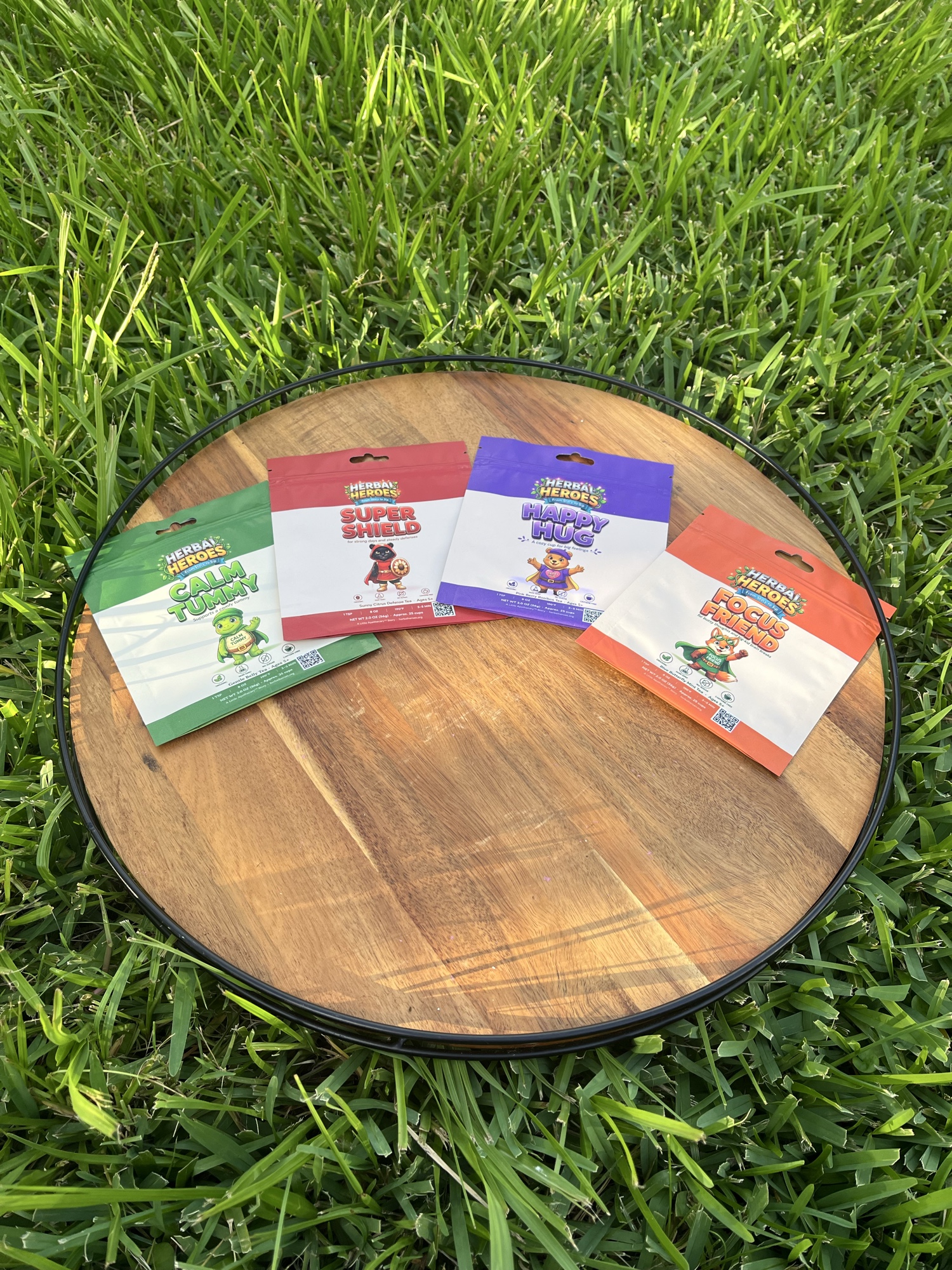 The four Herbal Hero pouches in hand